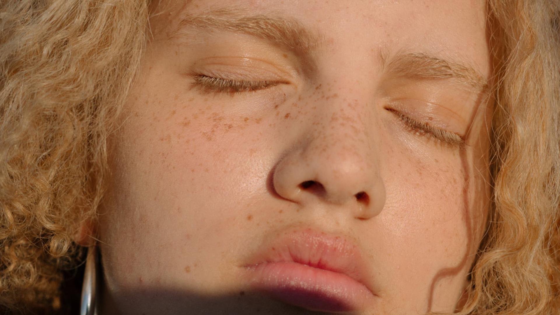 Close-up portrait of a person with eyes closed, reflecting on moving an old 401k