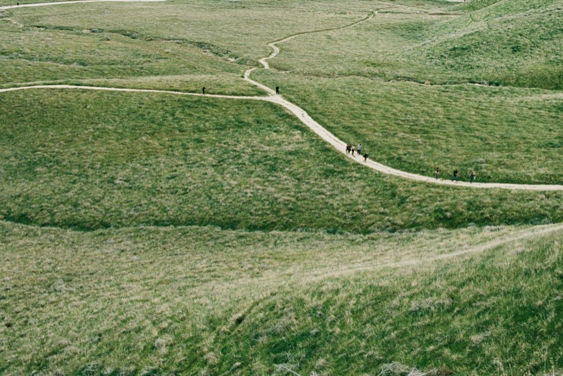 Winding path through open grassland, suggesting a retirement journey